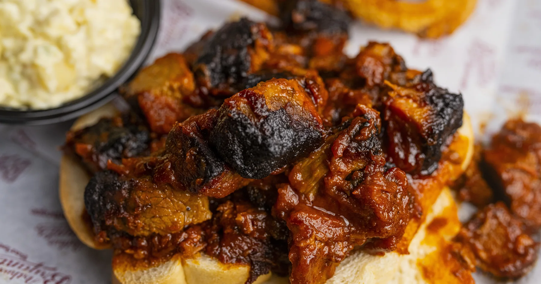 Arthur Bryant’s sauced burnt ends with a side of coleslaw