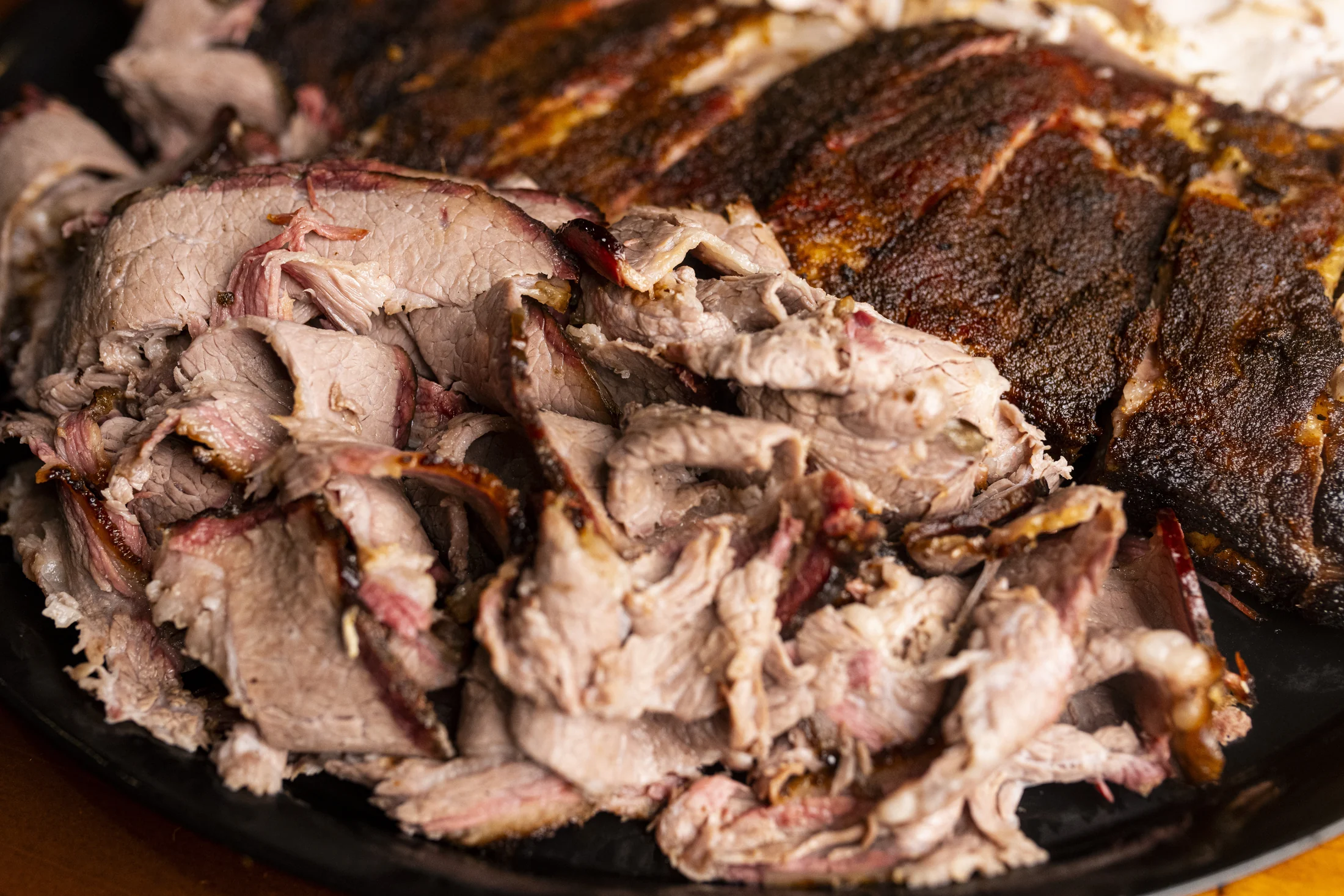 Arthur Bryant’s catering platter with sliced brisket and smoked ribs